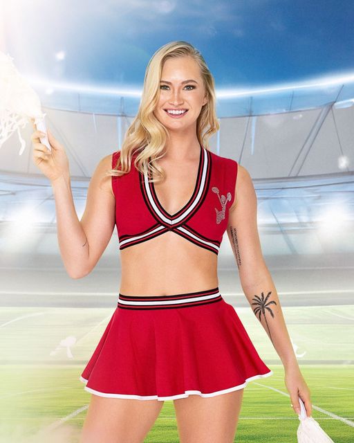 Women's cheerleader costume with pom-poms